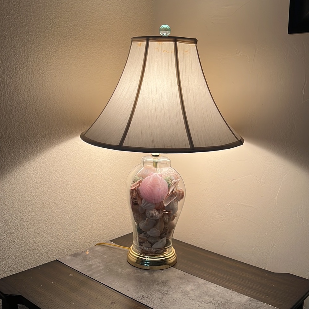 Seashell filled glass table top lamp